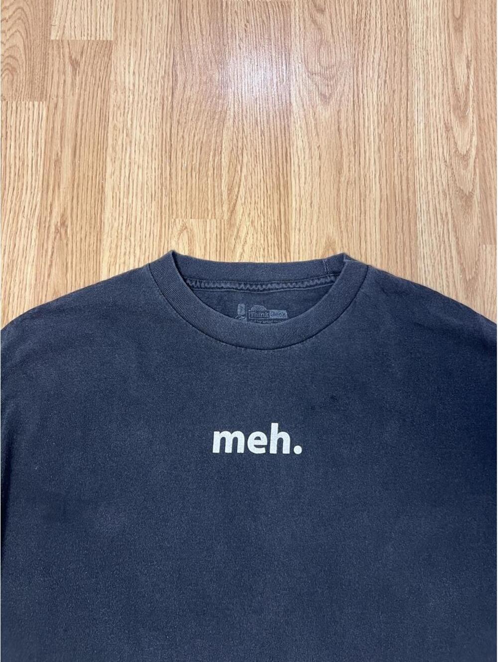 Meh. Faded black t-shirt